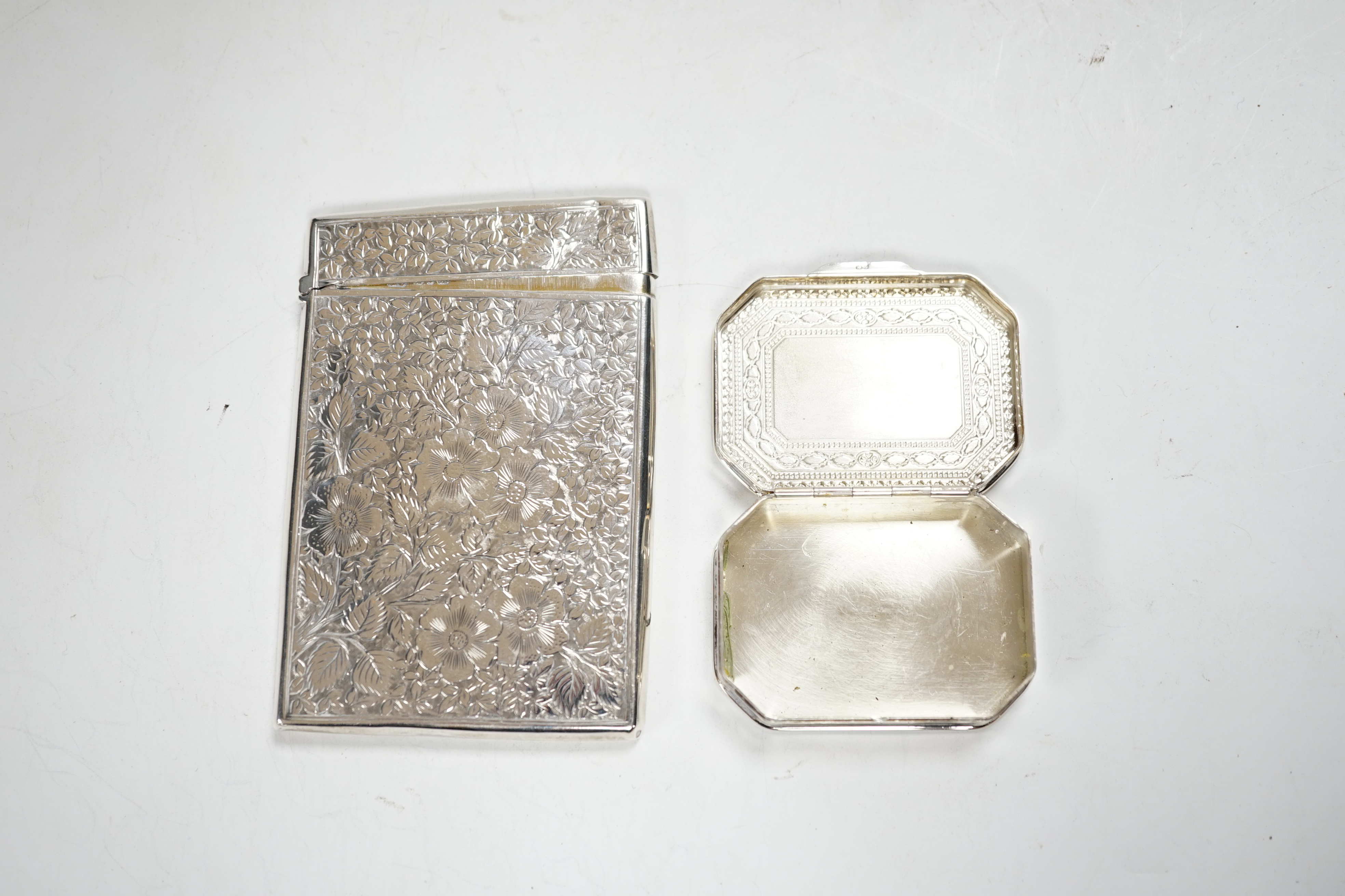 A late Victorian engraved silver rectangular card case, George Unite, Birmingham, 1895, 99mm, together with a modern silver pill box.